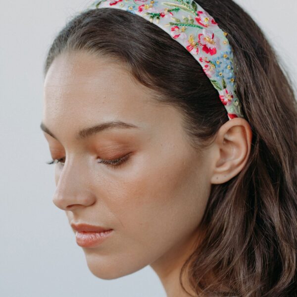 The Laine Headband is made by hand in New York from grosgrain featuring hand embroidery and lined in silk charmeuse to ensure ultimate comfort and promote hair health. We recommend storing headbands in their dust bag while not in use. Avoid contact with water