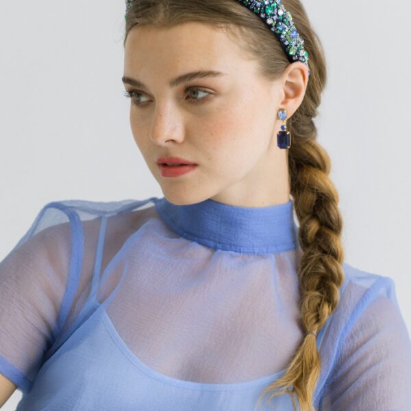 The Mimi Headband is made in New York of hand-embroidered crystals on a flexible and comfortable silk lined headband base. We recommend treating this headband as you would a piece of jewelry