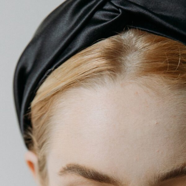 The Twist Headband in Silk Satin is made by hand in New York from silk satin