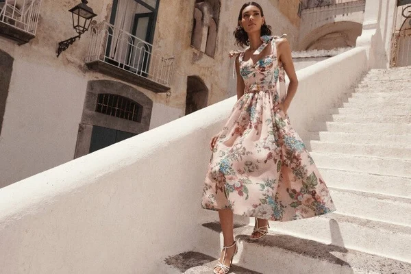 Model wearing sleeveless Zimmermann dress