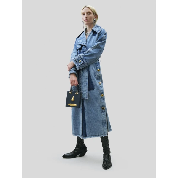 Model wearing Schiaparelli Mini Anatomy Jewelry Bag in blue leather