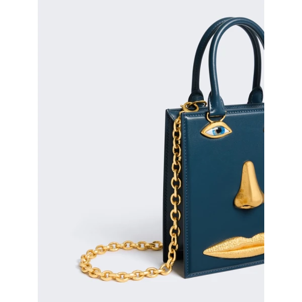 Schiaparelli Mini Anatomy Jewelry Bag in blue leather side view
