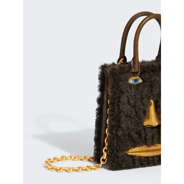 Schiaparelli Mini Anatomy Jewelry Bag in black leather side view