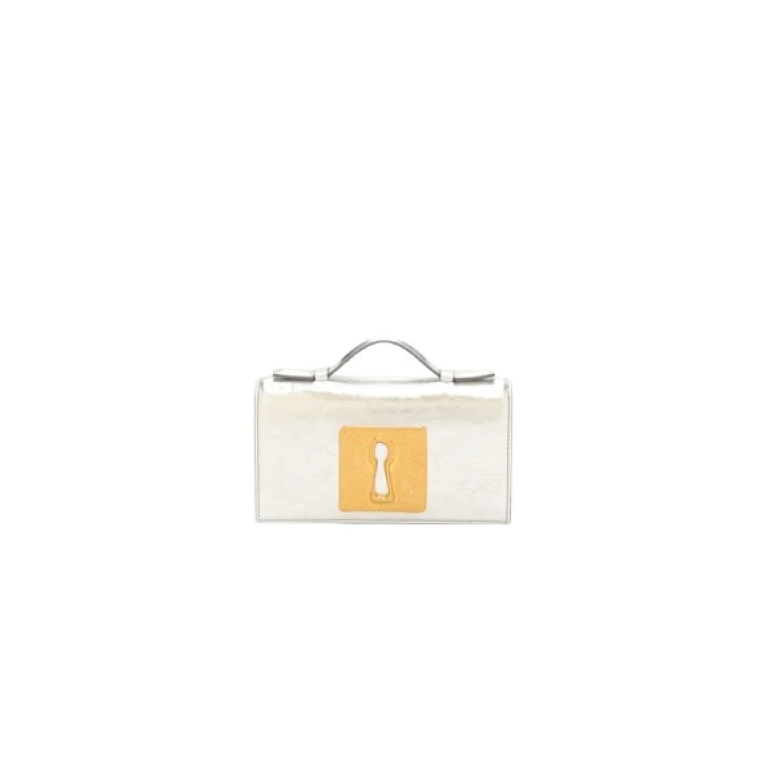 Schiaparelli Keyhole Clutch luxury Bags from  Luxury Handbags Marketplace