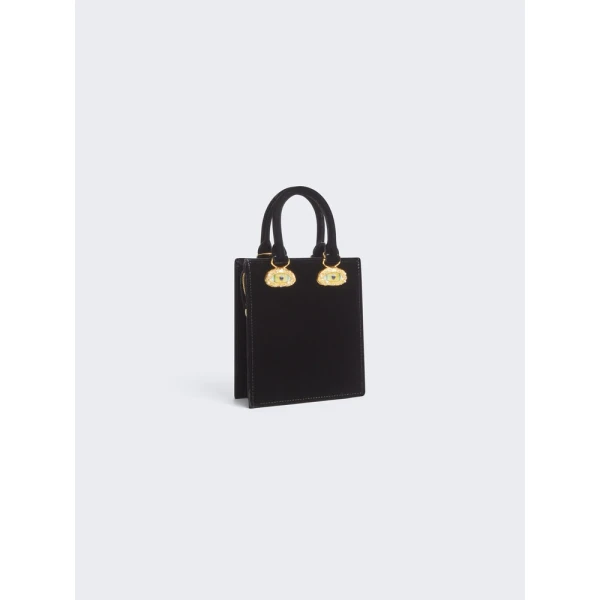 Schiaparelli Mini Anatomy Jewelry Bag in black velvet featuring gold nose and mouth hardware (Face Bag)