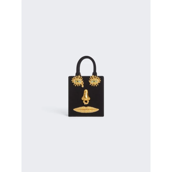 Schiaparelli Mini Anatomy Jewelry Bag in black velvet featuring gold nose and mouth hardware (Face Bag)