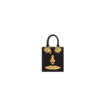 Schiaparelli Mini Anatomy Jewelry Bag in black velvet featuring gold nose and mouth hardware (Face Bag)