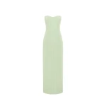 Leo Lin Zayna tweed bustier maxi dress in a light green color, featuring a strapless boned bodice, a fitted waist, and a gently flared skirt with a high slit, modeled by a person with light brown hair posing gracefully.