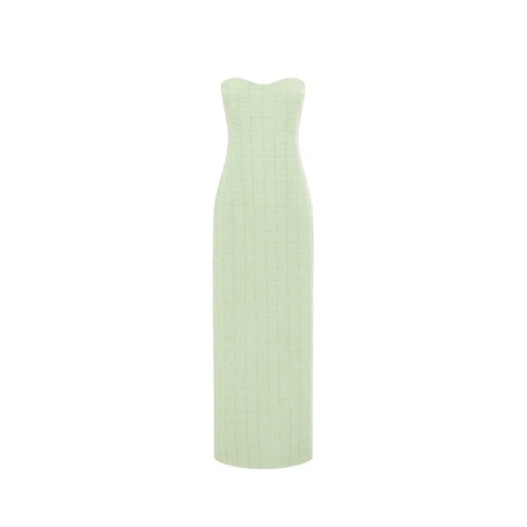Leo Lin Zayna tweed bustier maxi dress in a light green color, featuring a strapless boned bodice, a fitted waist, and a gently flared skirt with a high slit, modeled by a person with light brown hair posing gracefully.