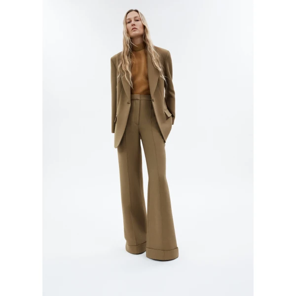 the pant features a high waist