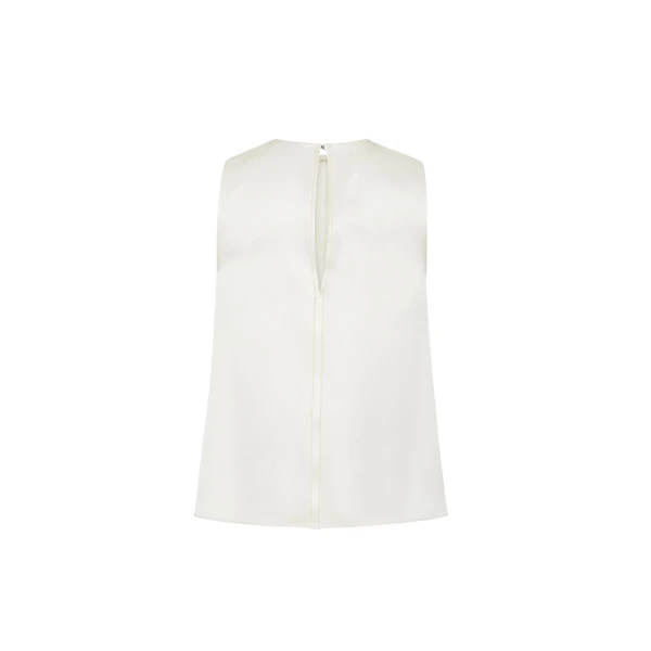 the Elias Top flows with effortless ease in a sleeveless silhouette that falls gracefully from the shoulders.