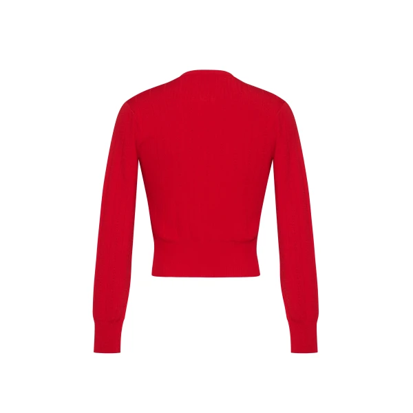 the piece is finished with covered buttons along the front placket for a refined look.