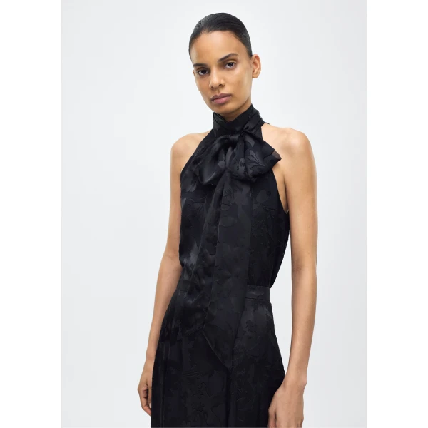 while the flowing silhouette exudes sophistication. Pair with the Emi Skirt in Devore for a coordinated ensemble.