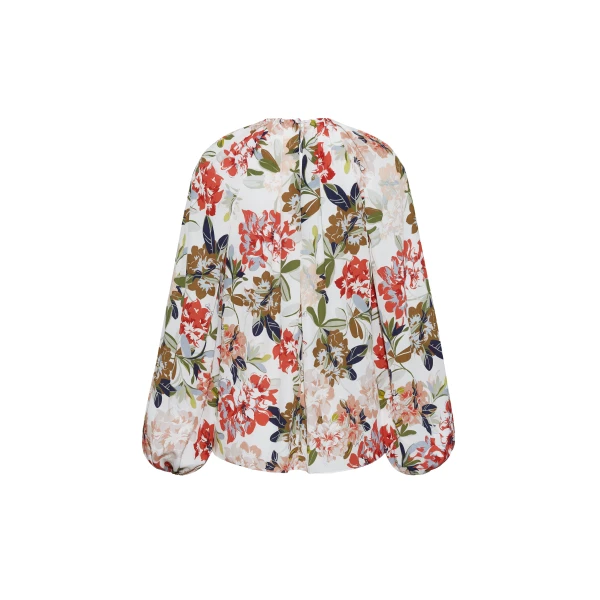featuring a classic ivory floral motif on refined crepe de chine. A delicately gathered neckline