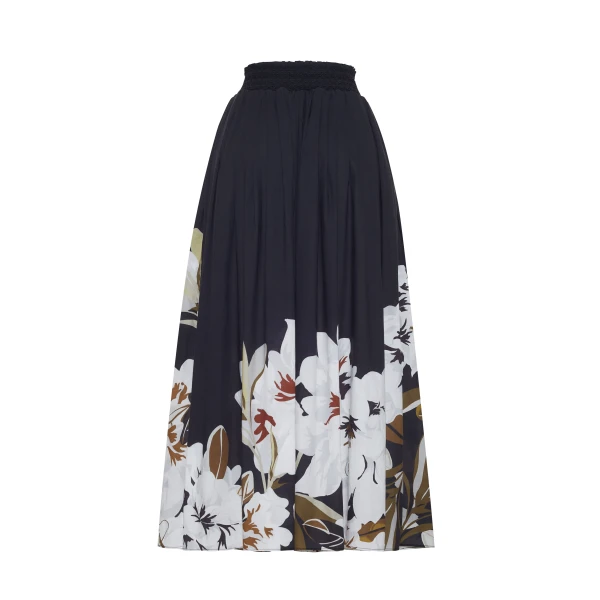 the Lovisa Skirt is crafted from airy printed voile featuring a vibrant Sicily-inspired floral motif. Designed with a smocked waistband for a comfortable fit