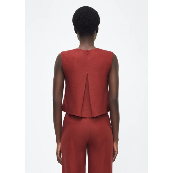 P25 collection: This cropped-silhouette top is crafted from stretch canvas in a rich sienna hue