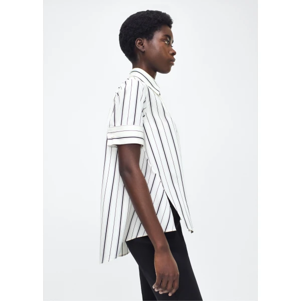 collar stand and French cuffs. Designed with side slits for a breezy