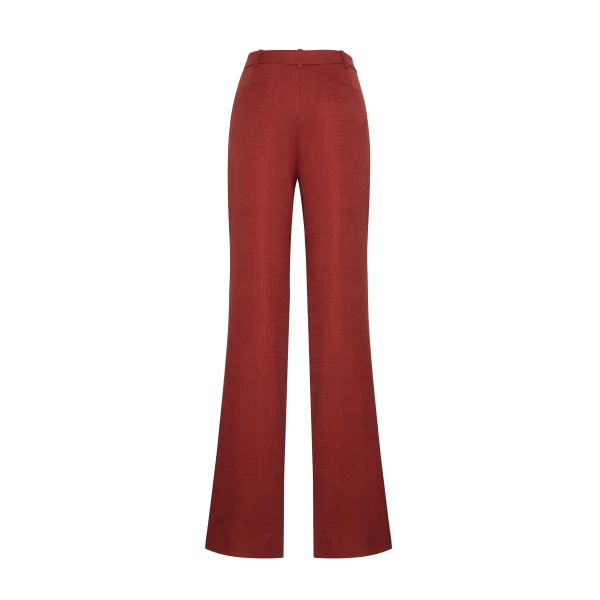 crafted in lightweight canvas and rendered in a rich sienna hue. The silhouette is clean and elongating