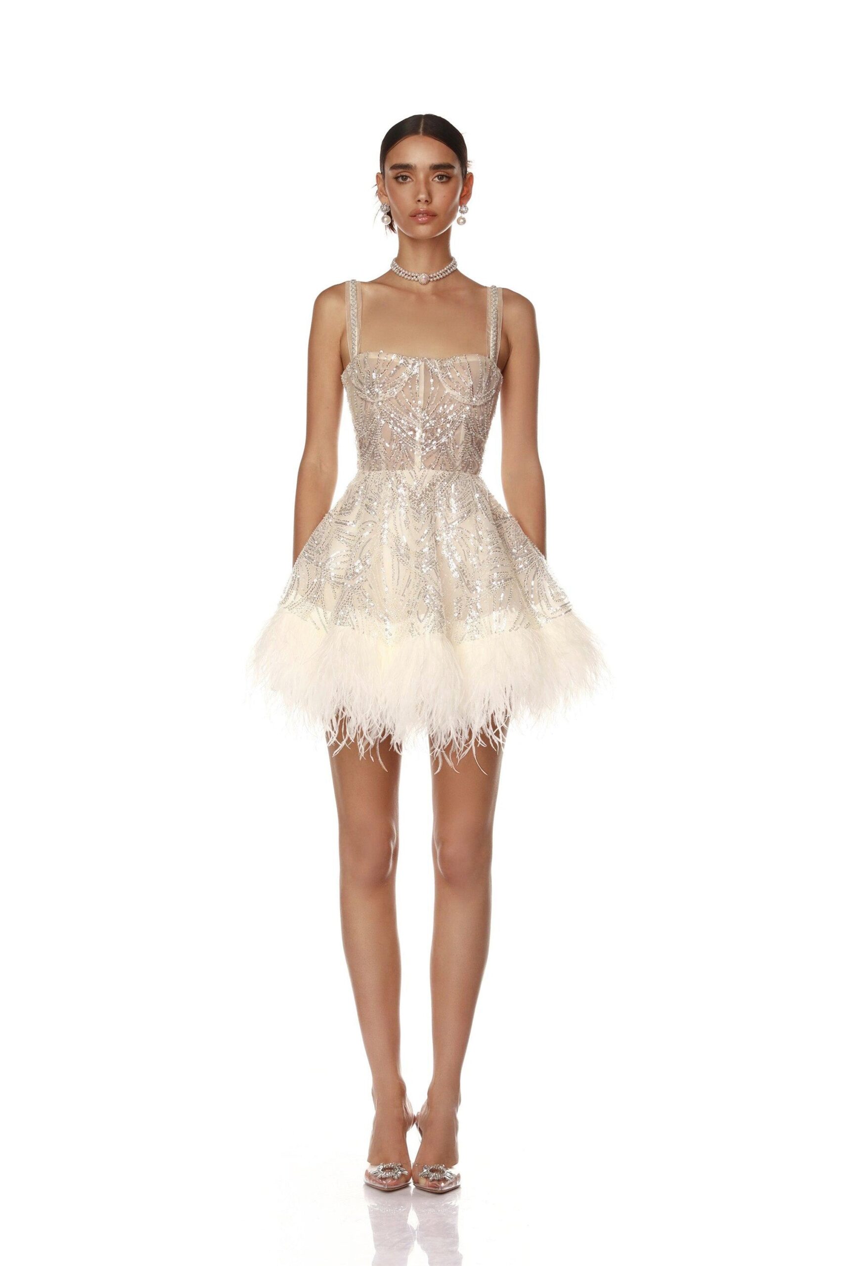 Bronx and Banco White Mademoiselle Beaded Mini Dress  a harmonious blend of structured elegance and timeless sophistication