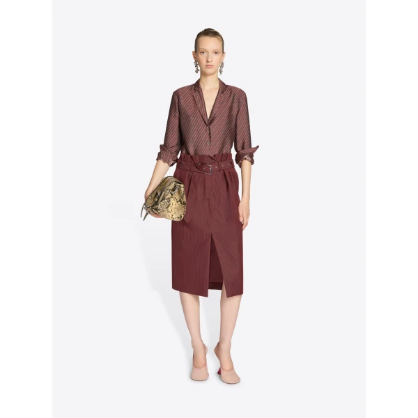 with belt and irregular pleats.