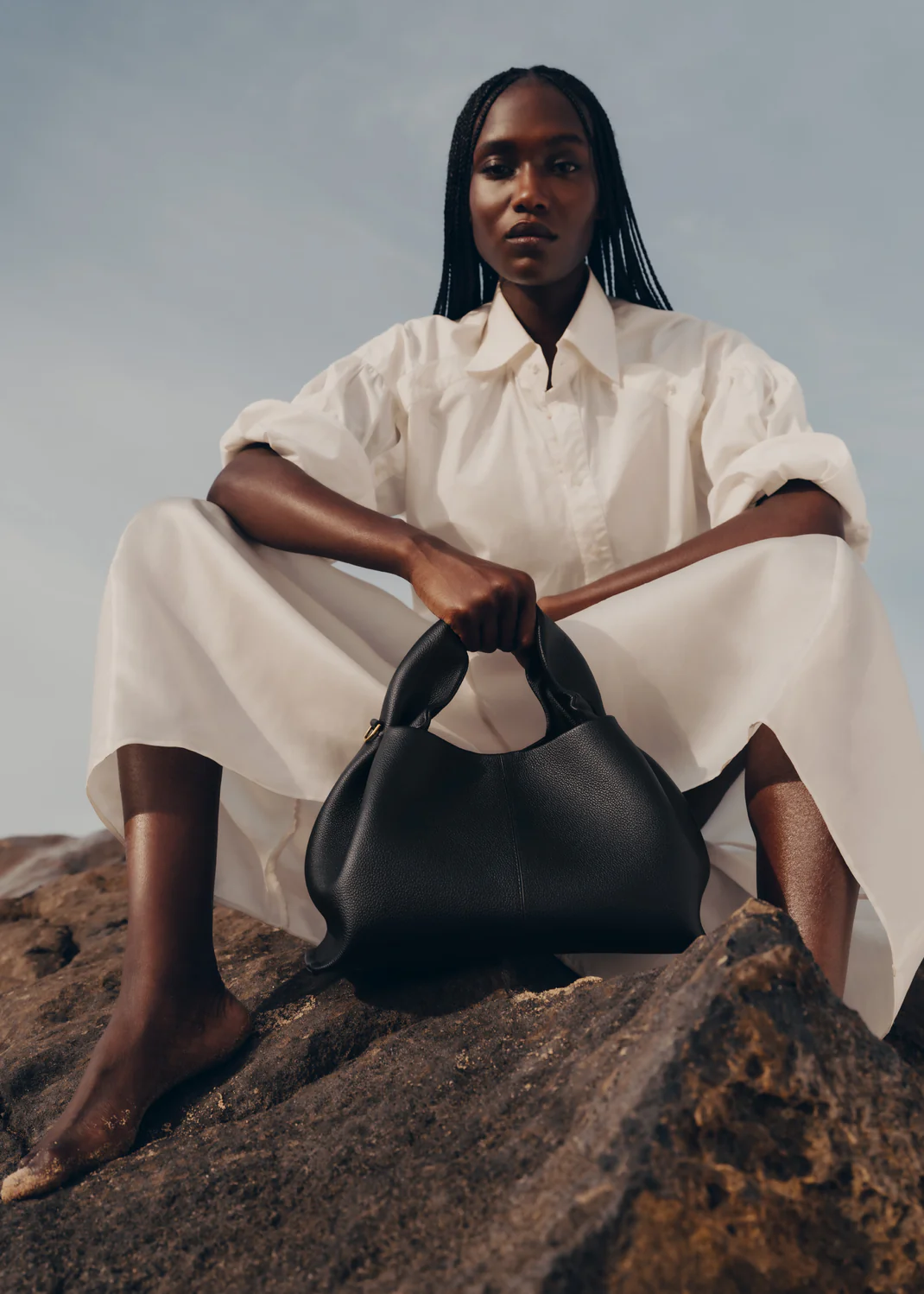 Polène Numéro Neuf in black styled with slip dress and gold jewelry