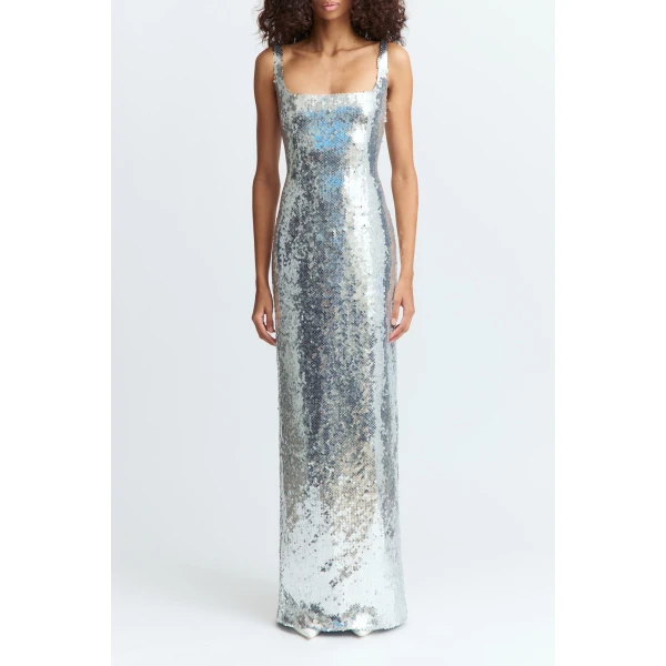 floor-grazing dress crafted from reflective sequin that catches the light from every angle. It features a straight neckline and a body-hugging fit
