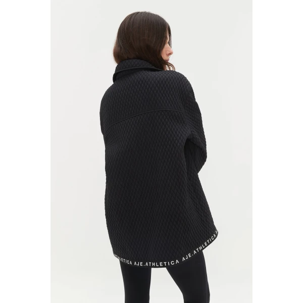 Aje Aus Tops – structured silhouette with raw femininity from Luxury Shoes 