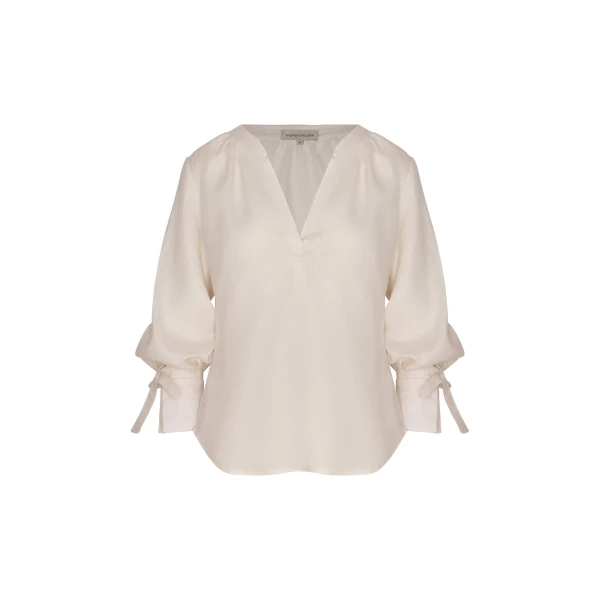Andres Otalora luxury designer Top with bold silhouette in linen