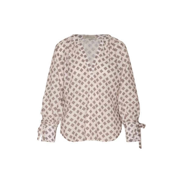Andres Otalora luxury designer Top with bold silhouette in linen