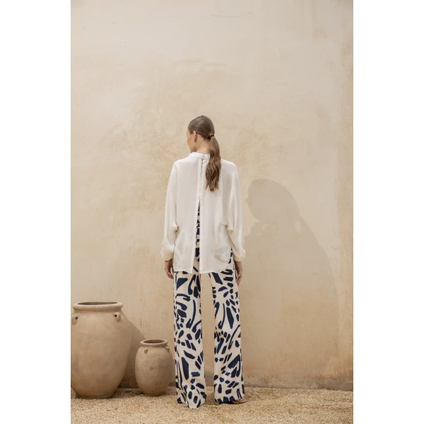 Andres Otalora luxury designer Top with bold silhouette in linen
