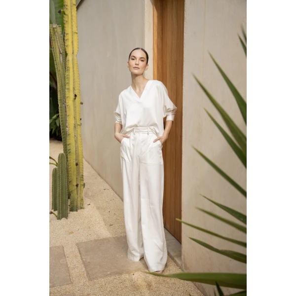 Andres Otalora luxury designer Top with bold silhouette in linen