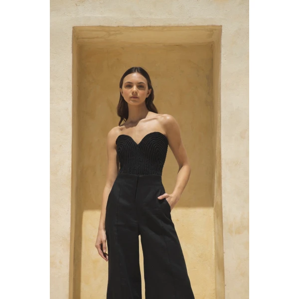 Andres Otalora luxury designer Top with bold silhouette in linen