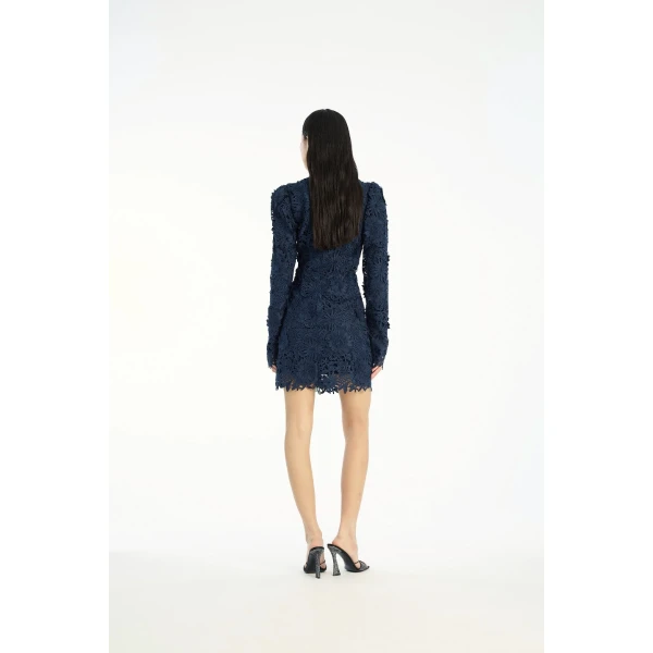 Rotate Blue from  Luxury Handbags – bold silhouette in vibrant color