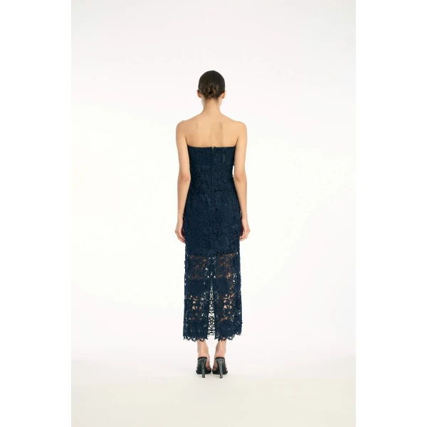 Rotate Blue from  Luxury Handbags – bold silhouette in vibrant color