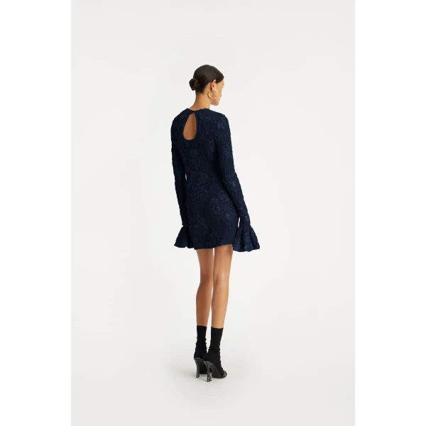 Rotate Blue from  Luxury Handbags – bold silhouette in vibrant color