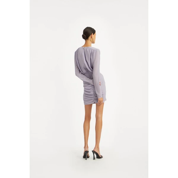 Rotate Purple from  Luxury Handbags – bold silhouette in vibrant color