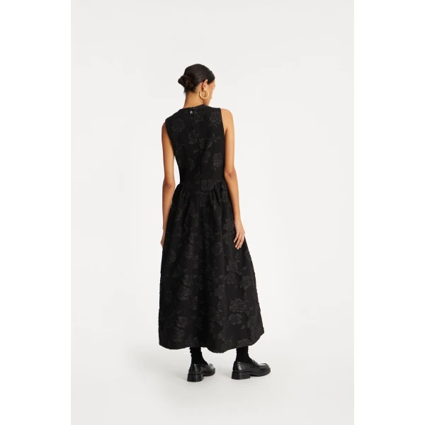 Rotate Black from  Luxury Handbags – bold silhouette in vibrant color