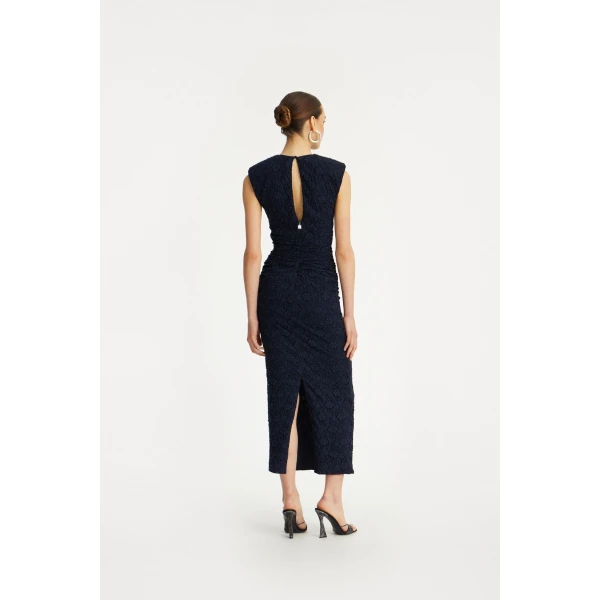 Rotate Blue from  Luxury Handbags – bold silhouette in vibrant color