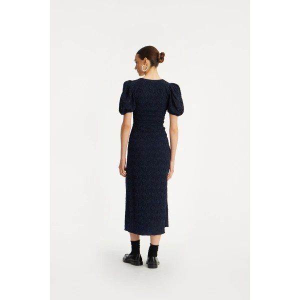 Rotate Blue from  Luxury Handbags – bold silhouette in vibrant color