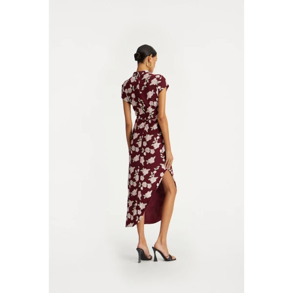 Rotate Red from  Luxury Handbags – bold silhouette in vibrant color