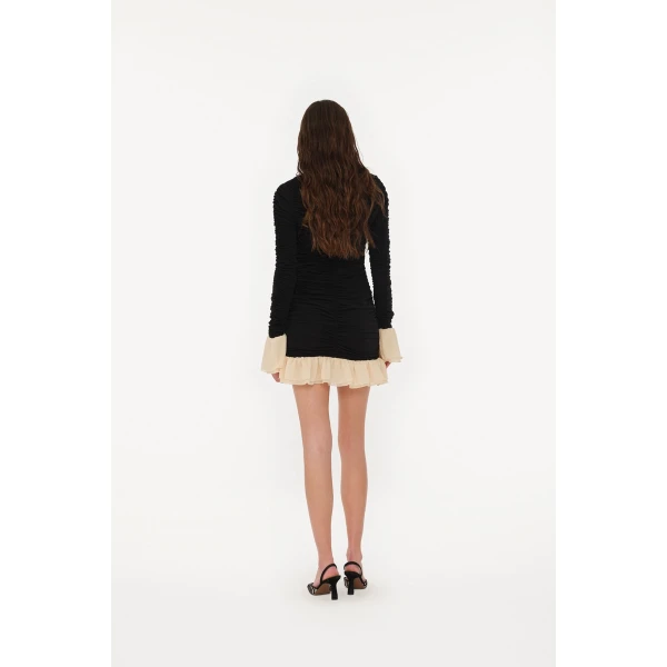 Rotate Black from  Luxury Handbags – bold silhouette in vibrant color