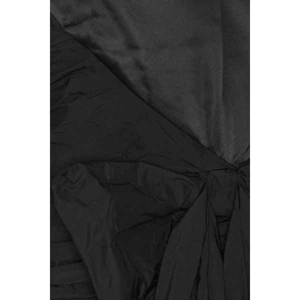 Rotate Black from  Luxury Handbags – bold silhouette in vibrant color
