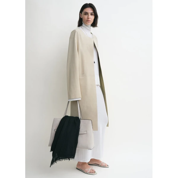 Toteme Coats with minimalist design at Luxury Shoes 