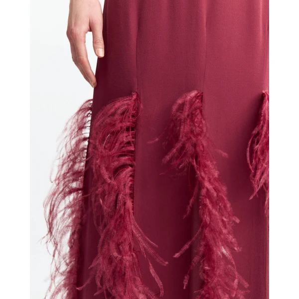 with feathered darting around the hem that adds soft texture and movement.