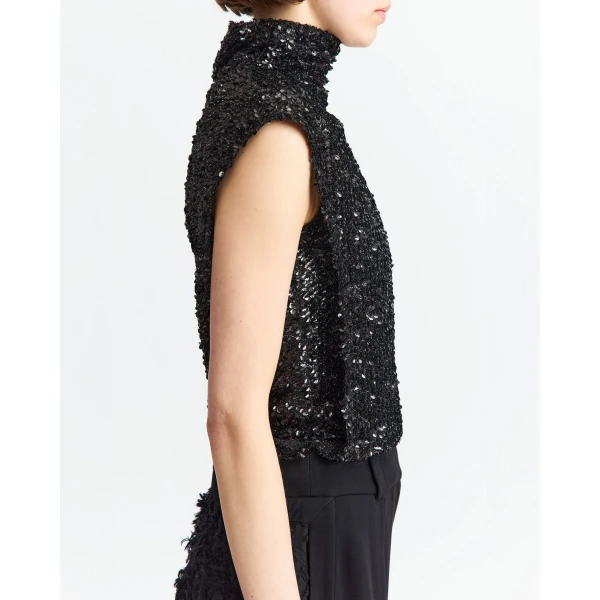 It features a subtle cap sleeve that softens the shoulder line