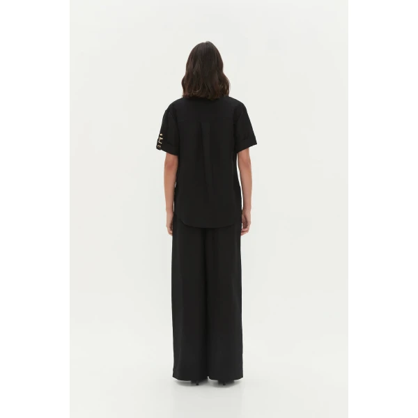 Aje Aus Pants – structured silhouette with raw femininity from Luxury Shoes 