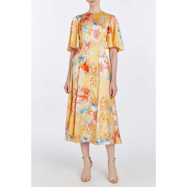 Markarian dresses with romantic neckline and structured silhouette
