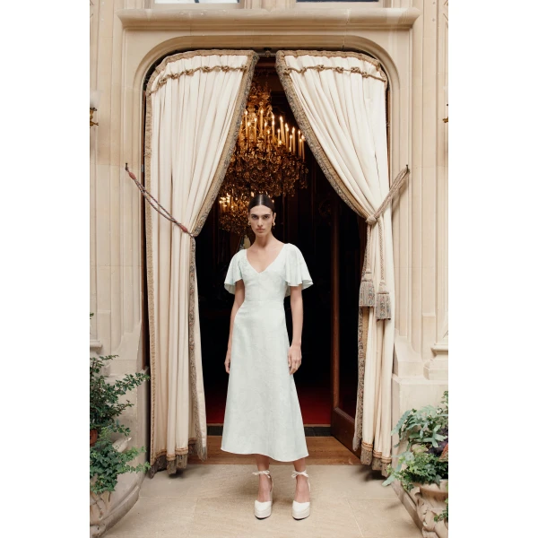 Markarian dress with romantic neckline and structured silhouette