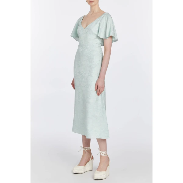Markarian gowns with romantic neckline and structured silhouette
