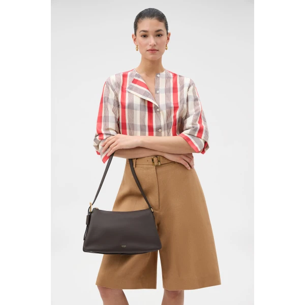 Profile view of model wearing the Oroton CALI SHOULDER BAG in DARK CHOCOLATE and Premium smooth leather for Women